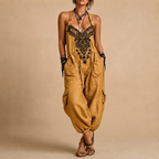 Théa Lightweight Embroidered Bohemian Jumpsuit in Yellow shown in front view with embroidered details and a relaxed silhouette.
