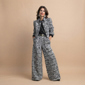 Valentina Frayed Jacket and Pants Two-Piece Set in Black shown in front view with frayed trim jacket and matching pants.
