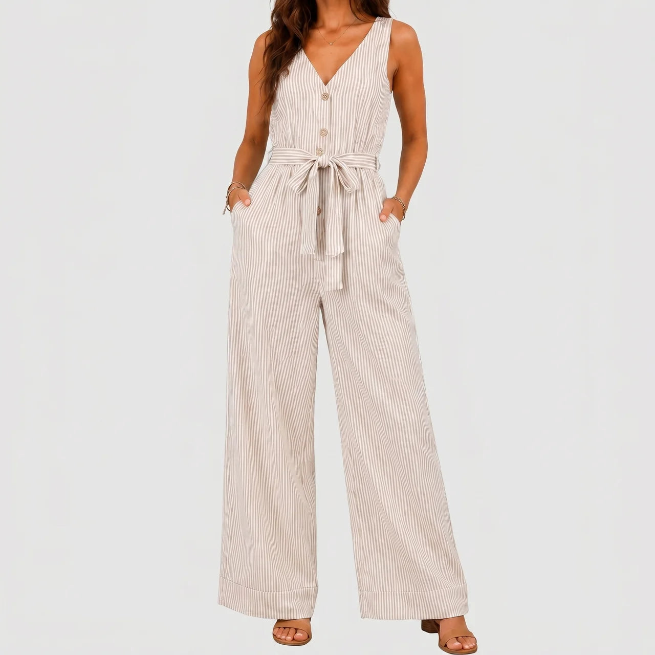 Front view of White striped wide leg jumpsuit with tie waist and sleeveless design by BELLA HUDSON