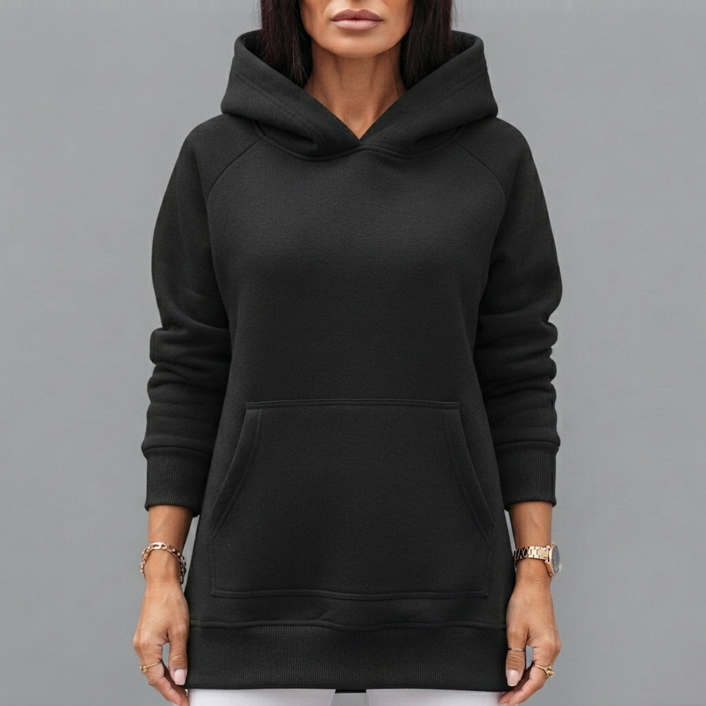 Front close-up of the Wilhelmine oversized side-slit hoodie in black, highlighting the cozy hood, soft fabric, relaxed fit, and stylish front details.