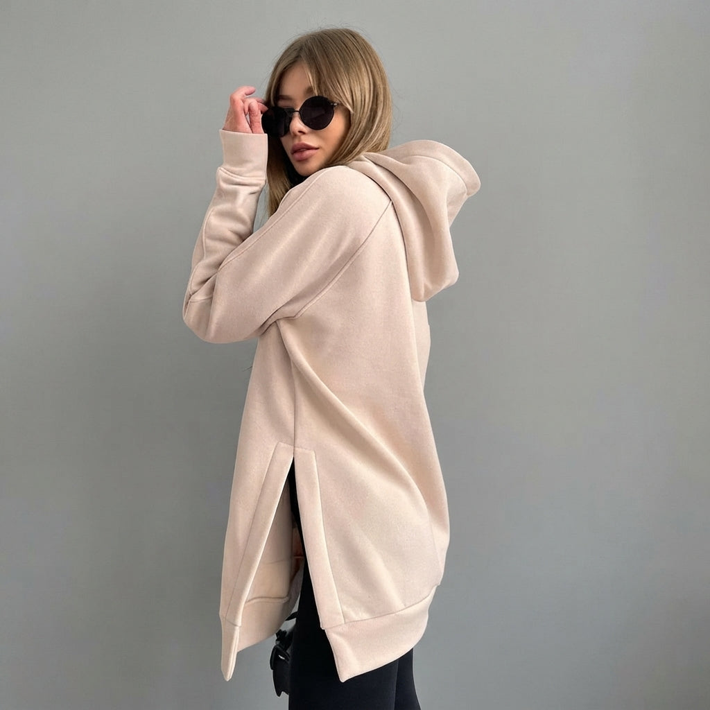 Front view of the Wilhelmine oversized side-slit hoodie in beige, featuring a relaxed oversized fit, cozy hood, long sleeves, and stylish side-slit detailing.