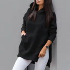 Front view of the Wilhelmine oversized side-slit hoodie in black, featuring a cozy hood, relaxed fit, long sleeves, and stylish side-slit detailing.