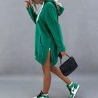 Front view of the Wilhelmine oversized side-slit hoodie in green, featuring a relaxed oversized fit, cozy hood, long sleeves, and stylish side-slit detailing.