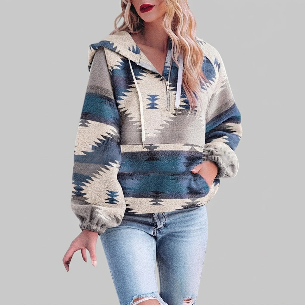 Front view of the blue red Zephira Hoodie Aztec-Print Half-Zip, featuring a bold Aztec print, attached hood, long sleeves, and half-zip front closure.