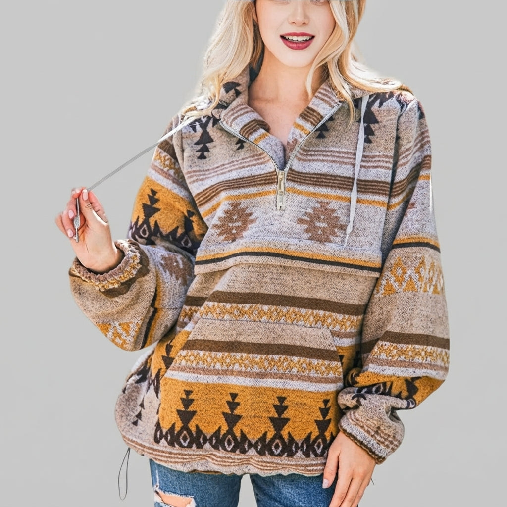 Front view of the orange red Zephira Hoodie Aztec-Print Half-Zip, featuring a bold Aztec print, attached hood, long sleeves, and half-zip front closure.
