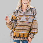 Front view of the orange red Zephira Hoodie Aztec-Print Half-Zip, featuring a bold Aztec print, attached hood, long sleeves, and half-zip front closure.