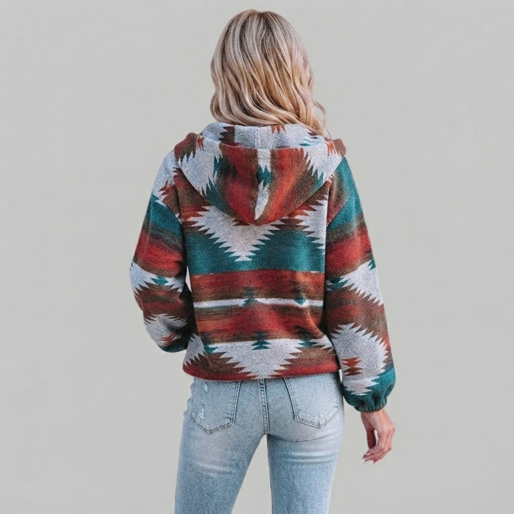 Back view of the red Zephira Hoodie Aztec-Print Half-Zip, showcasing the bold Aztec print, attached hood, long sleeves, and relaxed silhouette.