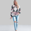 Front view of the rosa red Zephira Hoodie Aztec-Print Half-Zip, featuring a bold Aztec print, attached hood, long sleeves, and half-zip front closure.