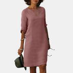 Front view of the Adele Shift Dress Lightweight V-Neck Half-Sleeve in dark pink, featuring a V-neckline, half sleeves, side pockets, and a relaxed knee-length silhouette. Designed by Bella Hudson.