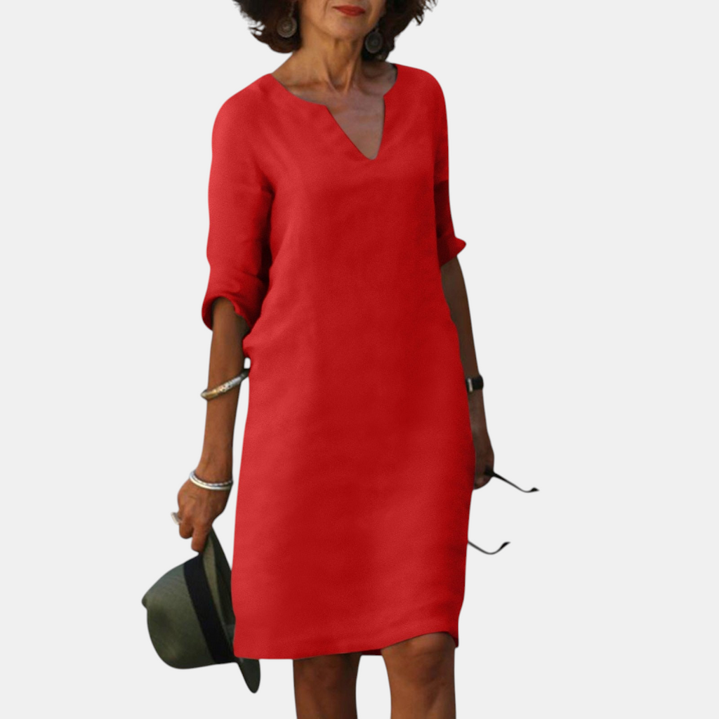 Front view of the Adele Shift Dress Lightweight V-Neck Half-Sleeve in red, featuring a V-neckline, half sleeves, side pockets, and a lightweight shift design. Designed by Bella Hudson.