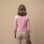 Back view of the Adeline Jacket Denim Cropped Button-Front in Pink, highlighting its cropped silhouette and structured denim design. Designed by Bella Hudson.