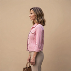 Side view of the Adeline Jacket Denim Cropped Button-Front in Pink, showcasing its cropped fit, structured silhouette, and long sleeves. Designed by Bella Hudson.