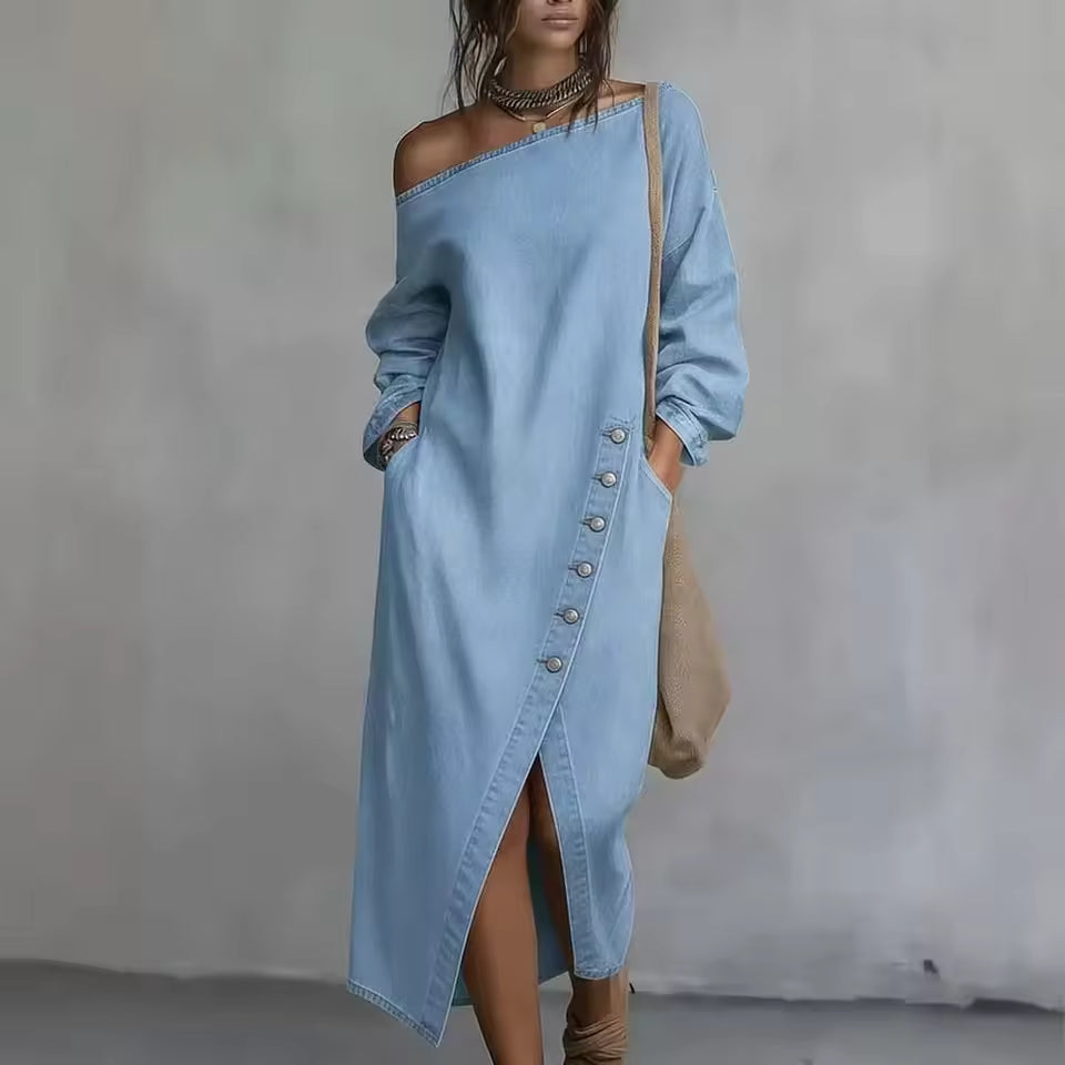 Adeline Light Blue denim maxi dress with asymmetric off-shoulder neckline, diagonal button detailing, long sleeves, and front slit