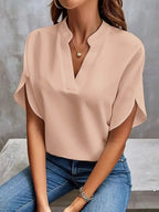 Front view of the Amandine Blouse V-Neck Flowy Short-Sleeve in pink, featuring a split V-neckline, flowy short sleeves, and a lightweight relaxed fit. Designed by Bella Hudson.