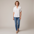 Front view of the Amandine Blouse V-Neck Flowy Short-Sleeve in white, featuring a split V-neckline, flowy short sleeves, lightweight fabric, and a relaxed everyday silhouette. Designed by Bella Hudson.