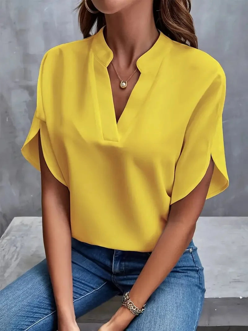 Front view of the Amandine Blouse V-Neck Flowy Short-Sleeve in yellow, featuring a split V-neckline, flowy short sleeves, and an airy everyday silhouette. Designed by Bella Hudson.