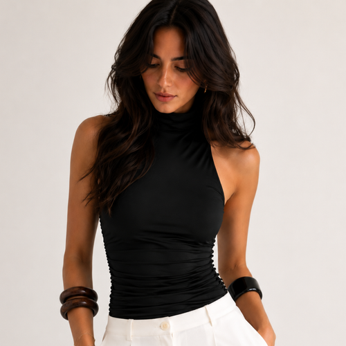 Side view of Amelia Halter Neck Open Back Tank Top in Black featuring a halter neckline and ruched fitted silhouette, designed by BELLA HUDSON