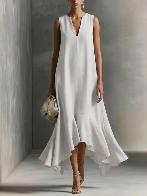 Front view of the Andrea Sundress V-Neck Flowy Ruffle-Hem in white, featuring a sleeveless V-neckline, relaxed bodice, flowing silhouette, and asymmetrical ruffle hem. Designed by Bella Hudson.