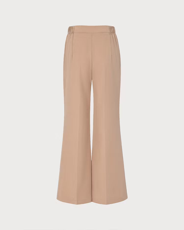 Anwen Khaki wide-leg pants shown from the back with a partially elasticated waistband and center crease.