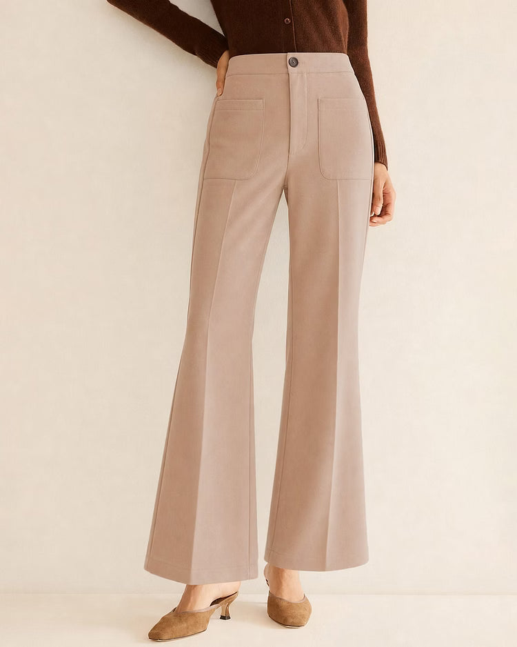 Anwen Khaki high-waisted pants shown from the front with patch pockets and a flared wide-leg hem.
