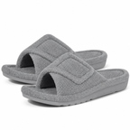 Aria Gray slide slippers featuring a soft fuzzy upper, adjustable strap, open-toe design, and low-profile sole