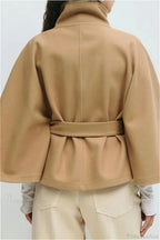 Arielle Khaki belted cape jacket shown from the back with the belt cinching the waist and wide batwing sleeves.