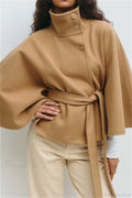 Arielle Khaki belted cape jacket shown from the front with stand collar, buttons, batwing sleeves and tied belt.