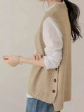 Audrey Beige knit sweater vest with sleeveless design, ribbed hem, and decorative side buttons