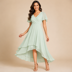 Bella Hudson Aveline Midi Dress in light green featuring a floral print, asymmetric hem, and flowy silhouette, front view.