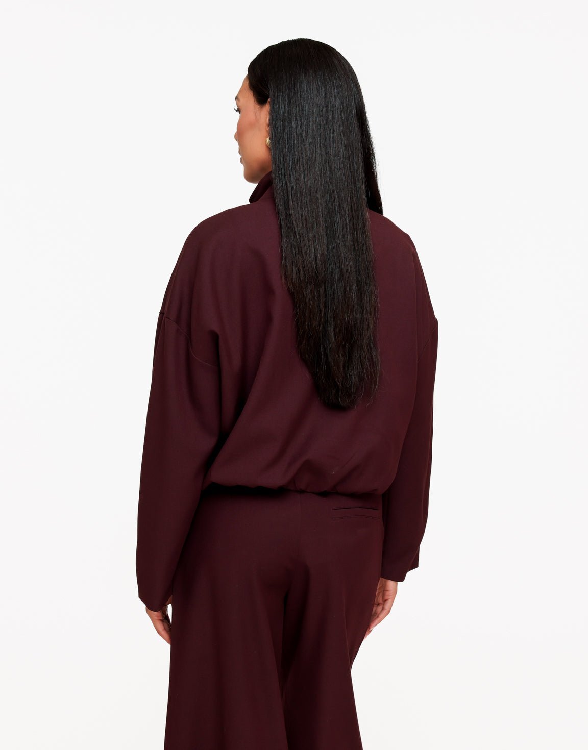 Averil Aubergine bomber jacket seen from the back showing drop shoulders and gathered hem.