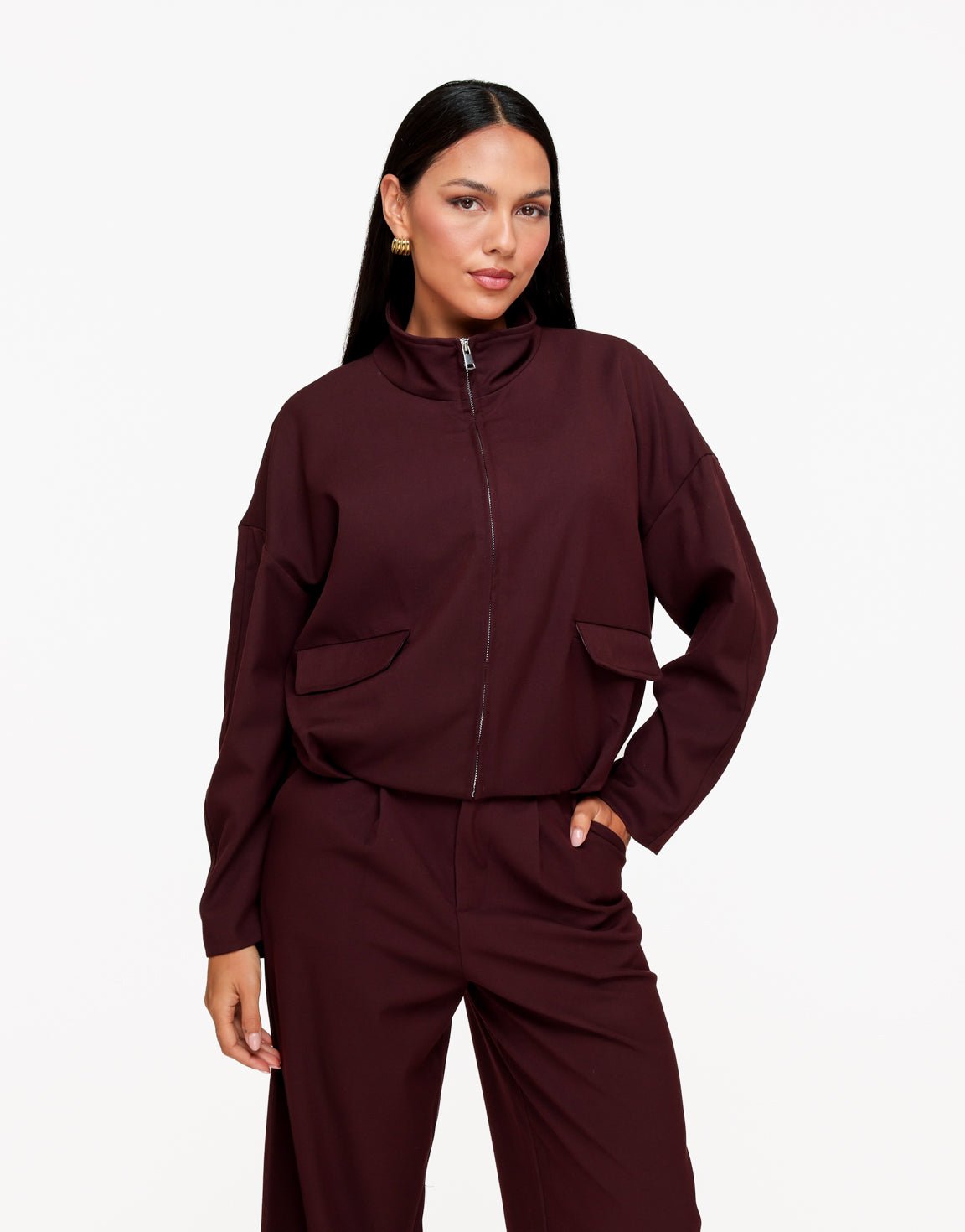Averil Aubergine bomber jacket with funnel neck and front zip, styled with matching trousers.