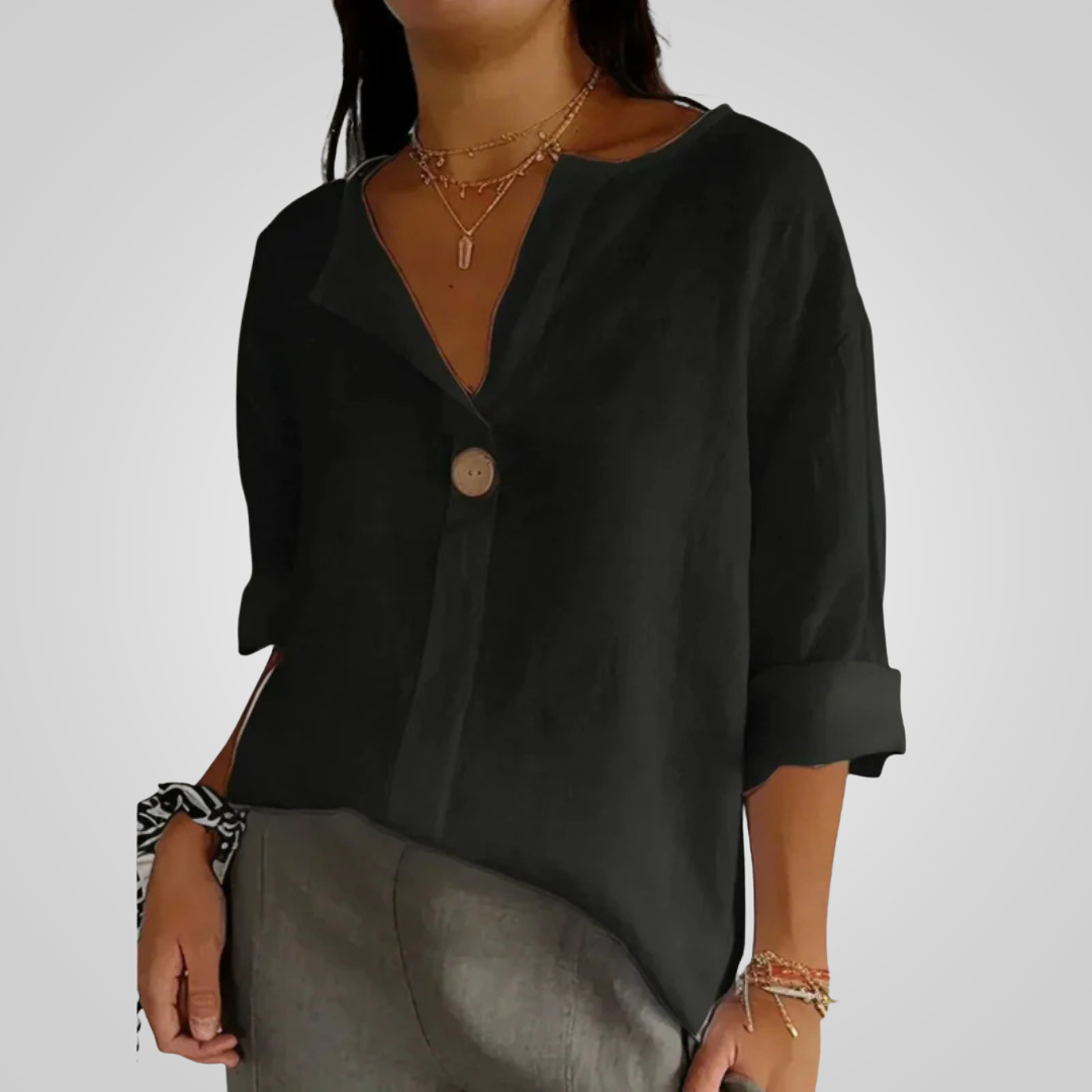 Front view of the Averil Blouse Linen Long-Sleeve in black, featuring a split V-neckline, long rolled sleeves, decorative button detail, and a relaxed lightweight silhouette. Designed by Bella Hudson.