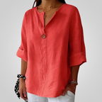 Front view of the Averil Blouse Linen Long-Sleeve in red, featuring a split V-neckline, long rolled sleeves, decorative button detail, and a relaxed linen silhouette. Designed by Bella Hudson.
