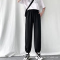Avery Black fleece-lined jogger pants with elastic waistband, adjustable drawstring, relaxed fit, side pockets, and elastic ankle cuffs