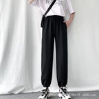 Avery Black fleece-lined jogger pants with elastic waistband, adjustable drawstring, relaxed fit, side pockets, and elastic ankle cuffs