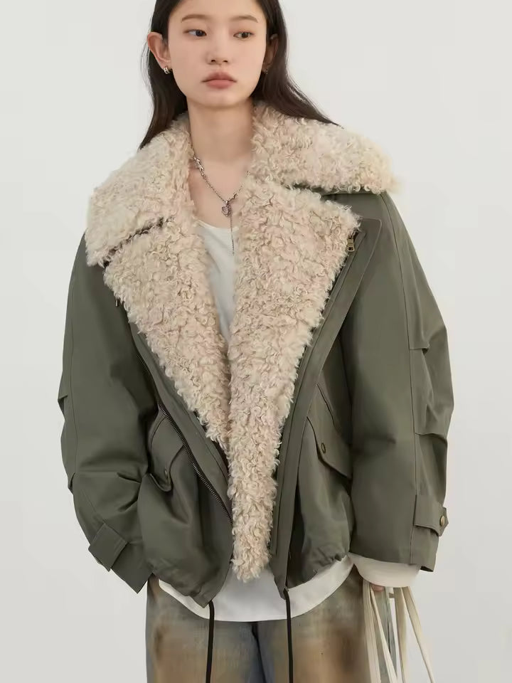 Avery oversized utility jacket featuring wide faux-shearling lapels, relaxed long sleeves, and layered front styling