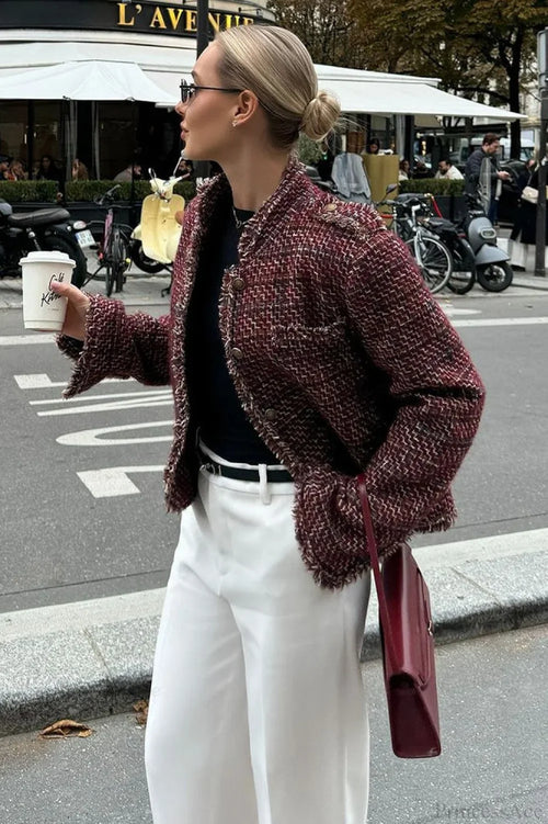 Avery Red tweed-textured cropped jacket shown from the side with fringed trim, a round neckline, and long sleeves