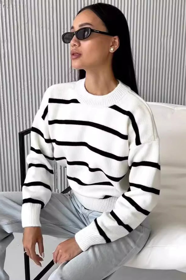 Avery White striped crew-neck sweater shown from the front with a relaxed fit, dropped shoulders, long sleeves, and ribbed trim