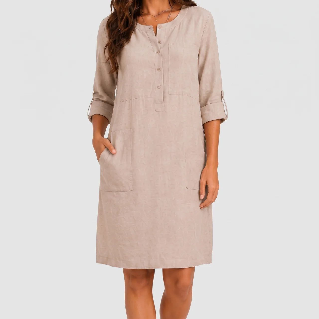 Front view of beige linen midi dress with rolled sleeves and side pockets by BELLA HUDSON