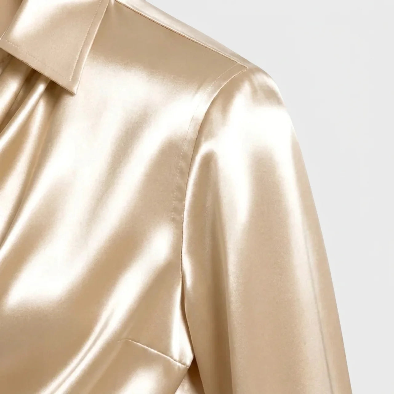 Close-up of beige satin cowl neck blouse fabric and shoulder detail BELLA HUDSON