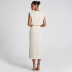 Back view of the Bella Women's Midi Dress in white, highlighting the sleeveless cut, cinched waist, and clean tailored midi silhouette. Designed by Bella Hudson.