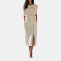 Front detail view of the Bella Women's Midi Dress in white, showcasing the decorative side buttons, side slit, sleeveless silhouette, and refined midi-length styling. Designed by Bella Hudson.