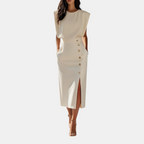 Front detail view of the Bella Women's Midi Dress in white, showcasing the decorative side buttons, side slit, sleeveless silhouette, and refined midi-length styling. Designed by Bella Hudson.