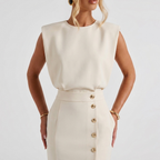 Close-up detail of the Bella Women's Midi Dress in white, featuring the round neckline, cinched waist, sleeveless design, and elegant tailoring. Designed by Bella Hudson.