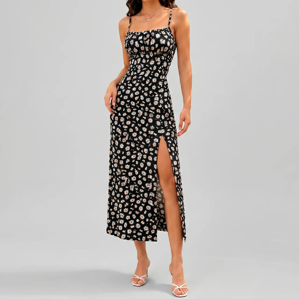 Front view of black floral slit maxi dress with spaghetti straps and fitted silhouette by BELLA HUDSON