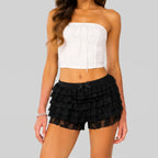 Front view of black layered ruffle mini shorts with elastic waist by BELLA HUDSON