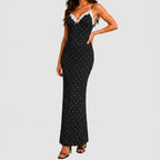 Front view of black polka dot maxi dress with white lace trim and spaghetti straps by BELLA HUDSON