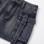 Close-up of blue denim cargo mini skirt with pocket and belt detail BELLA HUDSON