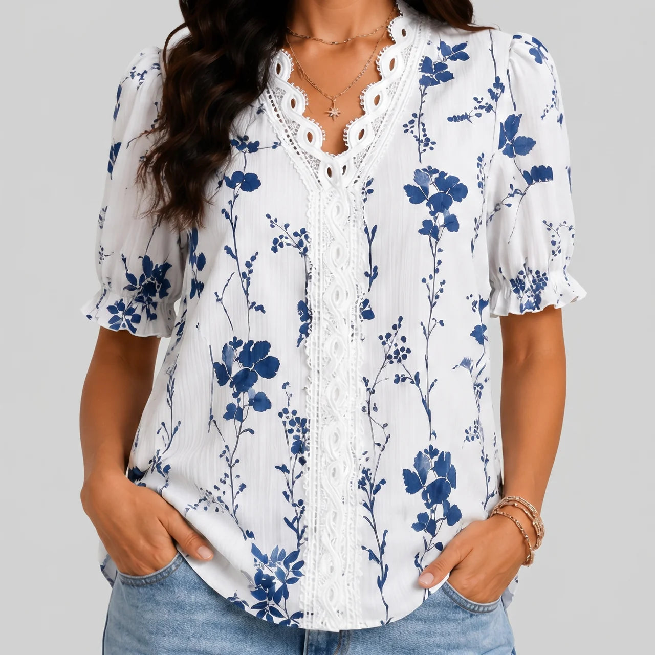 Front view of blue floral button blouse with short sleeves and relaxed fit by BELLA HUDSON