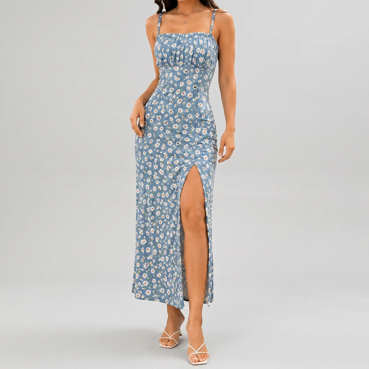 Front view of blue floral slit maxi dress with spaghetti straps and fitted silhouette by BELLA HUDSON